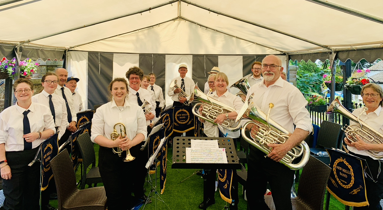 Brass Band with instruments standing under gazebo