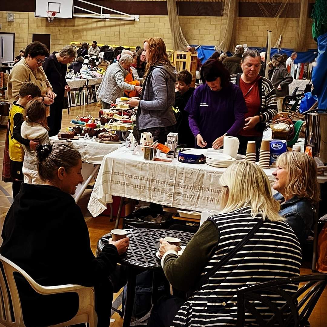 sports hall filled sales tables and people